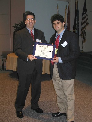 Mark Meaders (l), chapter chairman, presents the chapter's National Science Fair Award to Ben Agre.